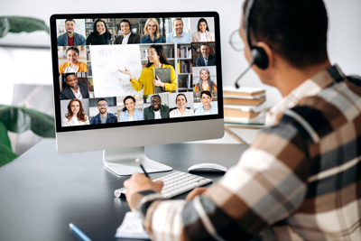 person attending a virtual meeting with multiple participants on the screen discussing topics related to collaboration and teamwork in a professional setting 3 strategies for teamwork